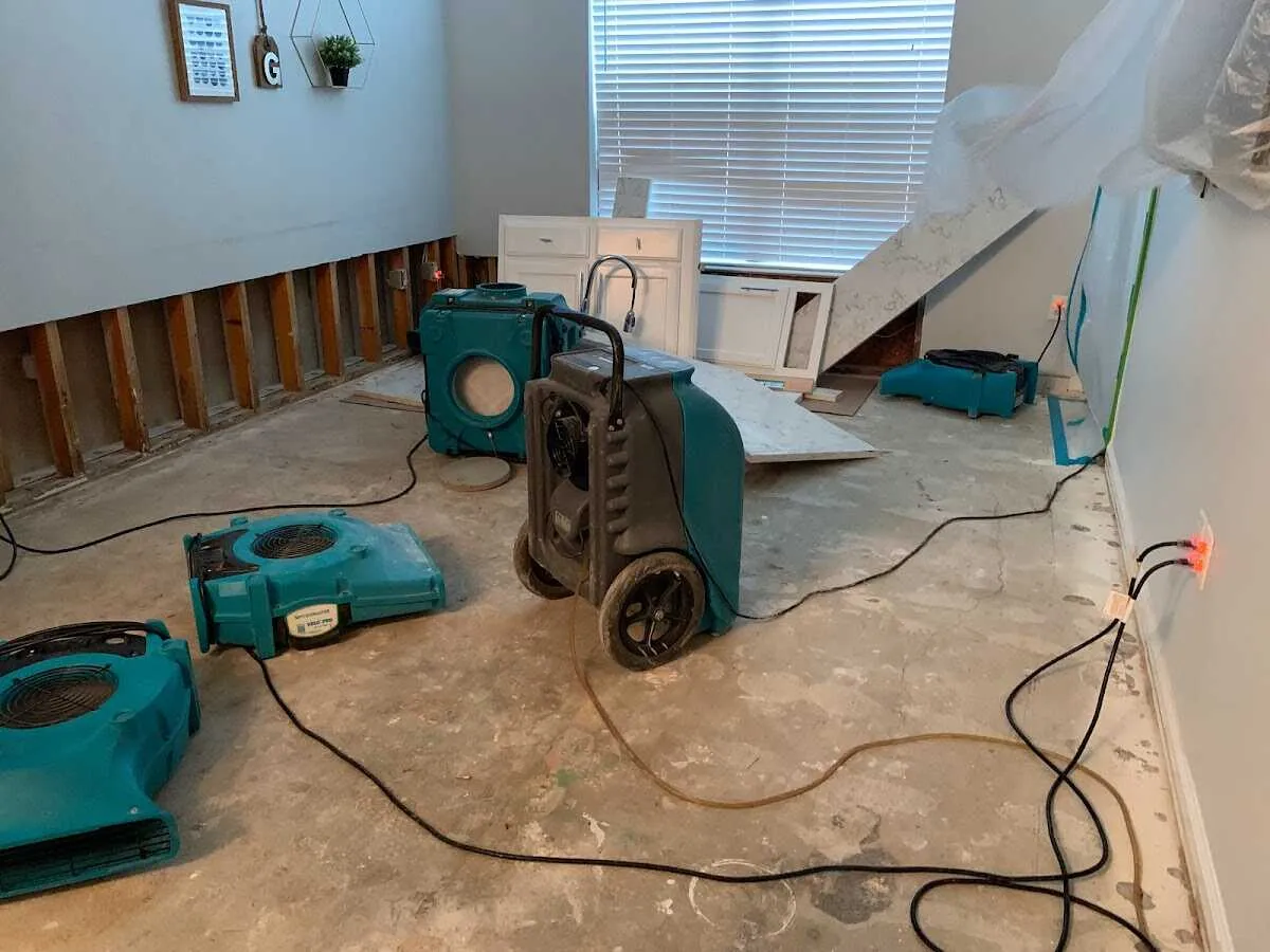 Dehumidifier in flood-cut room for Water Damage Restoration in Ross
